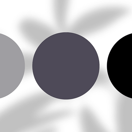 Three minimalist color swatches in grey, charcoal, and black on a white background