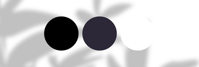 Three color swatches black, dark gray, white on abstract gray and white background