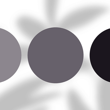 Three gray and black color swatches on a white background with blurred shadows