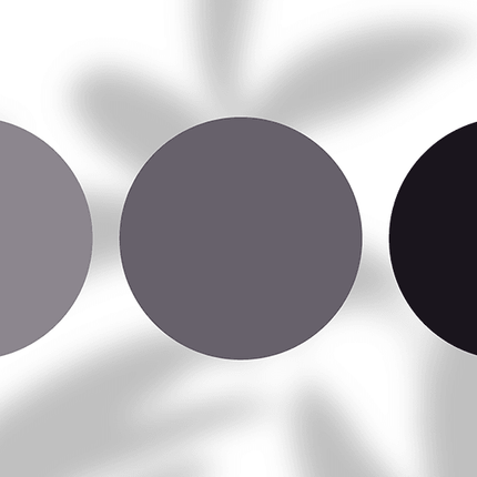 Three grey and black color swatches on a blurred abstract background, fashion palette