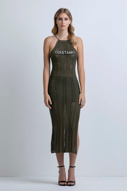 Woman wearing olive green crochet midi dress with halter neckline and 'ODI ET AMO' text