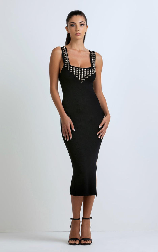 Woman wearing black sleeveless midi dress with metallic stud details, fashion dress