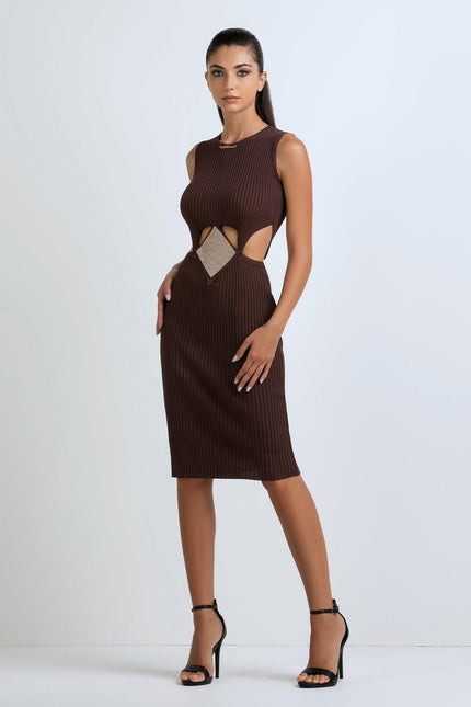 Woman wearing a ribbed brown cut-out midi dress with metallic detail and high heels
