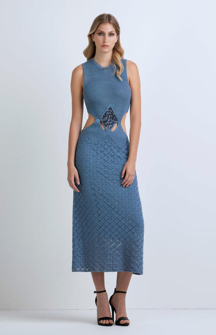 Woman wearing a blue knit sleeveless dress with side cutouts and textured pattern