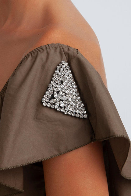 Off-shoulder brown dress with rhinestone triangle detail on sleeve