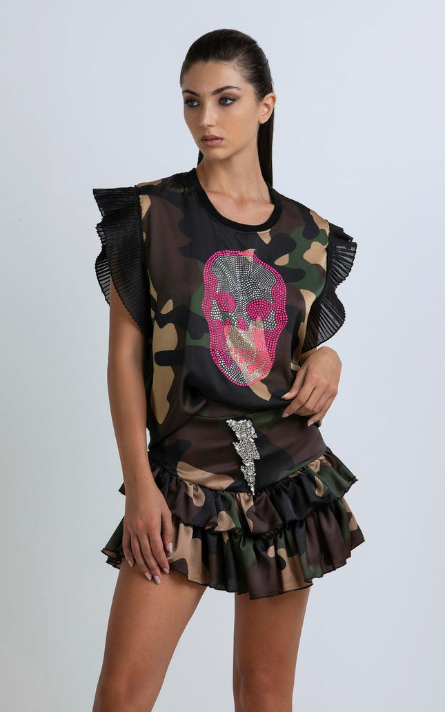 Woman wearing camouflage print ruffle dress with crystal skull and lightning details