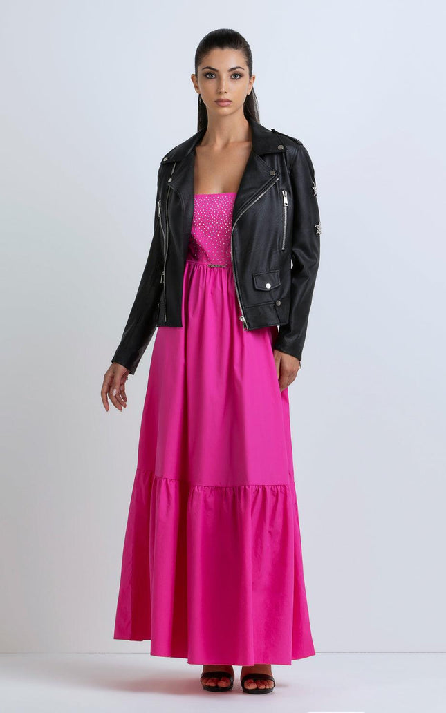 Woman in a black leather biker jacket and hot pink maxi dress, fashion studio shot