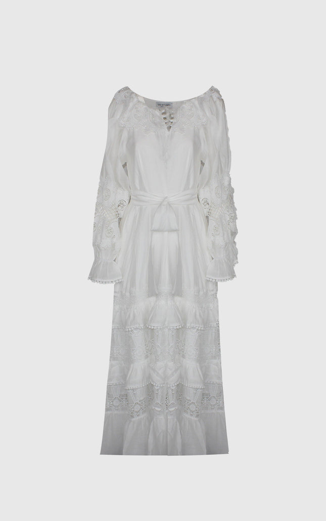 White long boho dress with lace details, tie waist, and flared sleeves on plain background