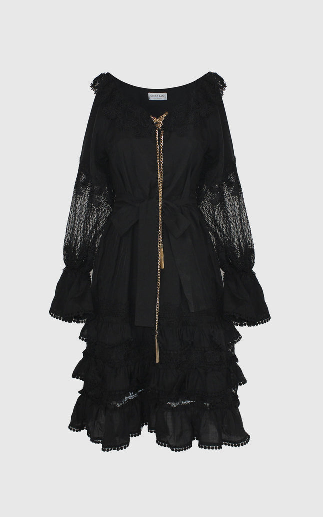 Black lace midi dress with long sleeves, ruffle layers, and gold chain detail