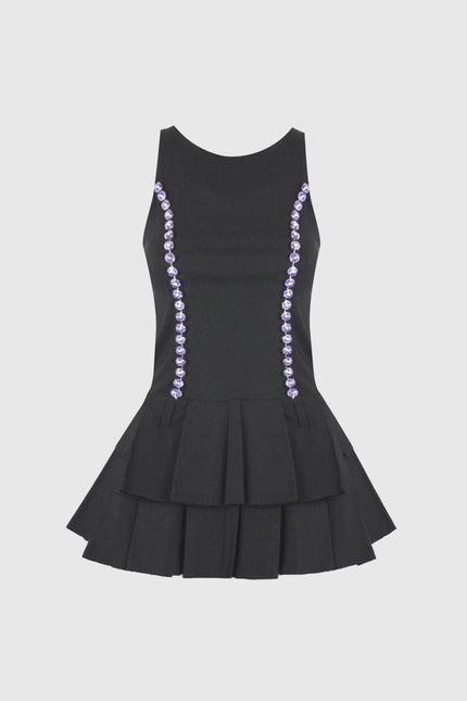 Black sleeveless mini dress with tiered skirt and purple gemstone details on sides