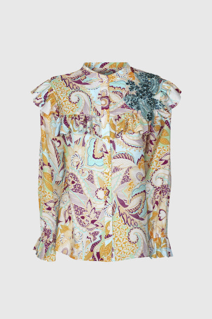 Colorful paisley print women's blouse with ruffle details and sequin embellishment on shoulder