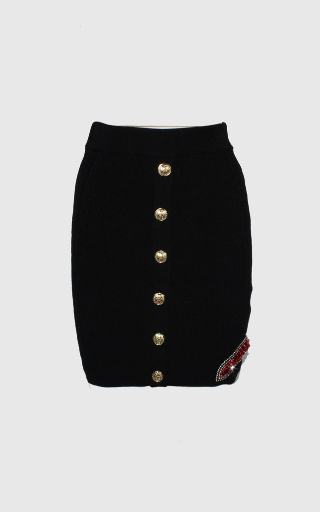 Black mini skirt with gold buttons and red beaded detail on white background