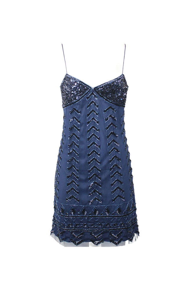 Blue sequin mini dress with thin straps and geometric patterns on a white background
