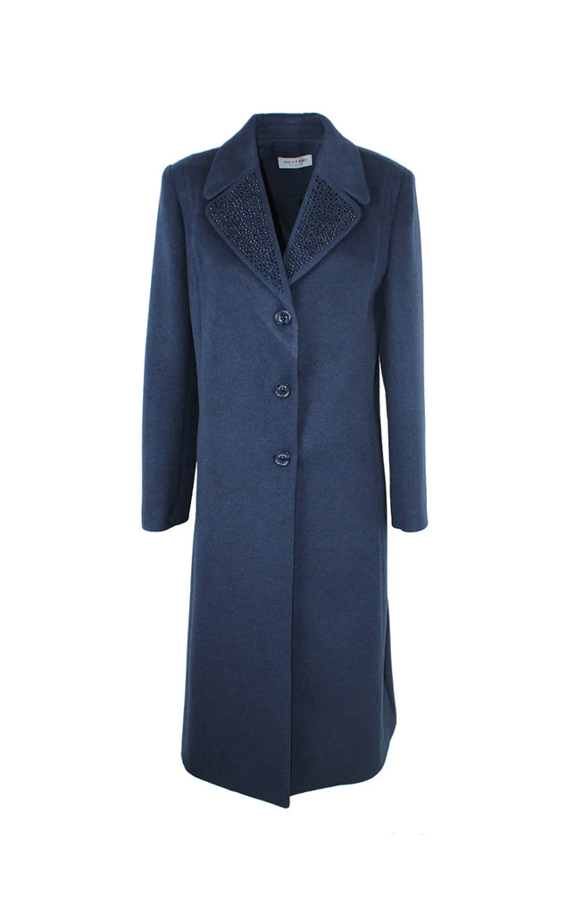 Long navy blue women's coat with button closure and embellished collar on white background