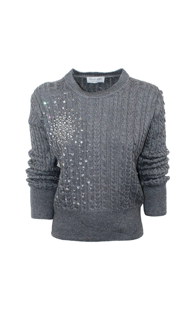 Gray cable knit women’s sweater with rhinestone embellishments on the chest
