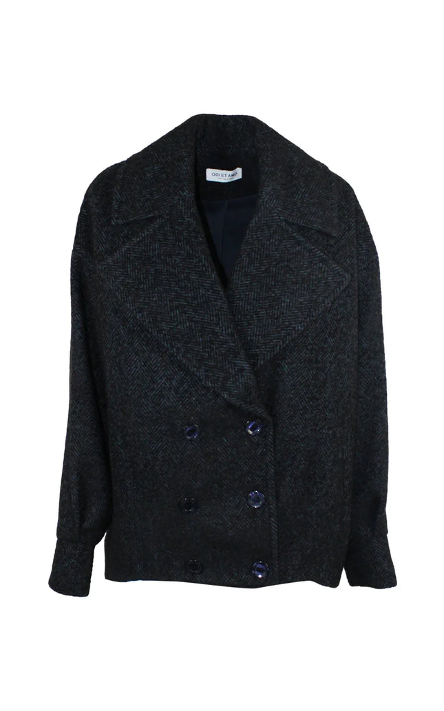 Women's dark double-breasted wool coat with wide lapels and herringbone pattern