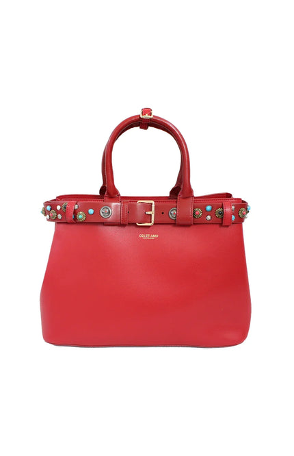 Red leather handbag with top handles, decorative studded belt, and gold buckle detail