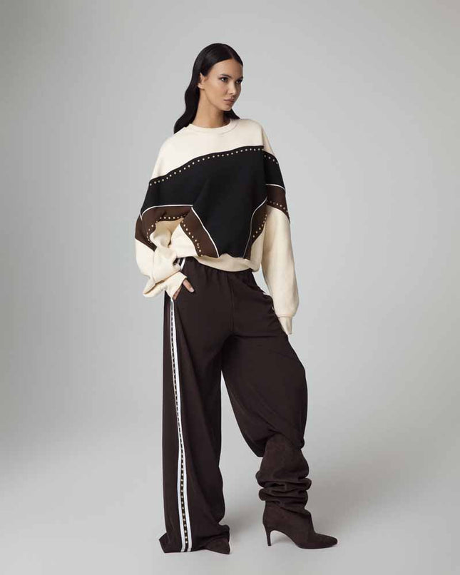 ALT Text: Women's PANTALONE A GAMBA LARGA SONIA CON BORCHIE AEOD0039