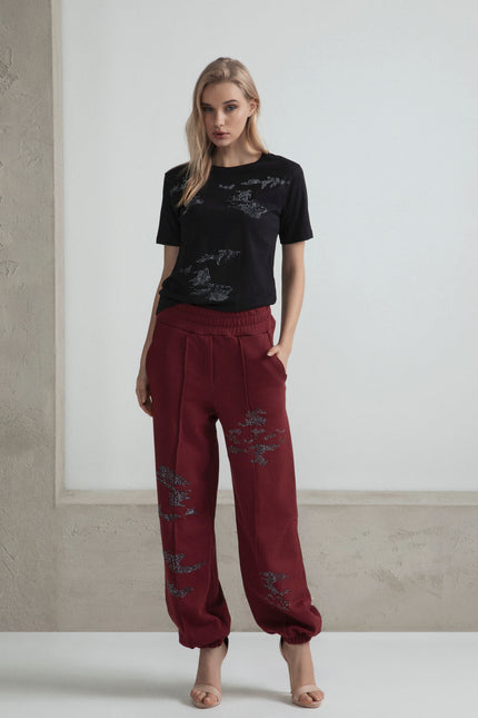 PANTALONI MORBIDI IN FELPA STRASS NERO CON MOTIVO MIMETICO