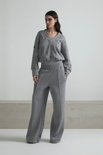 PANTALONE DI TUTA WIDE LEG CON BORCHIE OCCHIELLI E STRASS