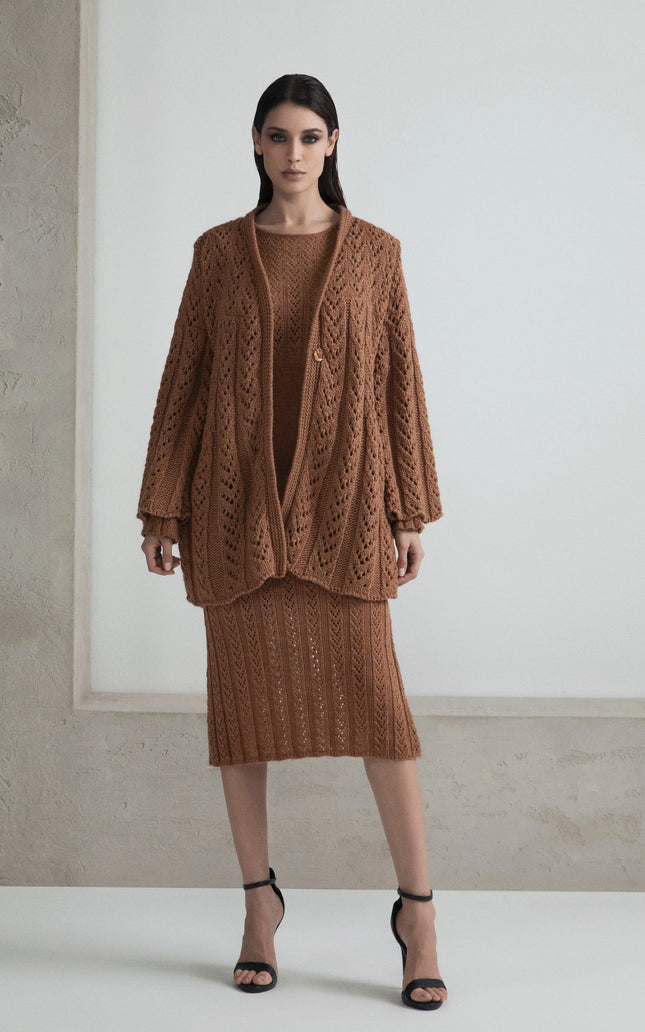 Woman wearing brown knit cardigan and matching skirt set, fashion clothing on model