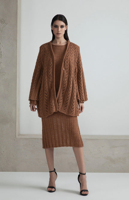 Woman wearing brown knit cardigan and matching skirt set, fashion clothing on model