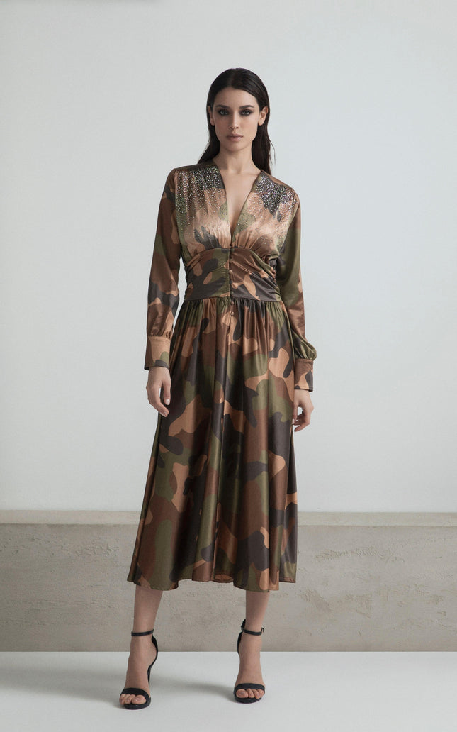 Woman wearing camouflage print long dress with deep V-neck and sequin embellishments