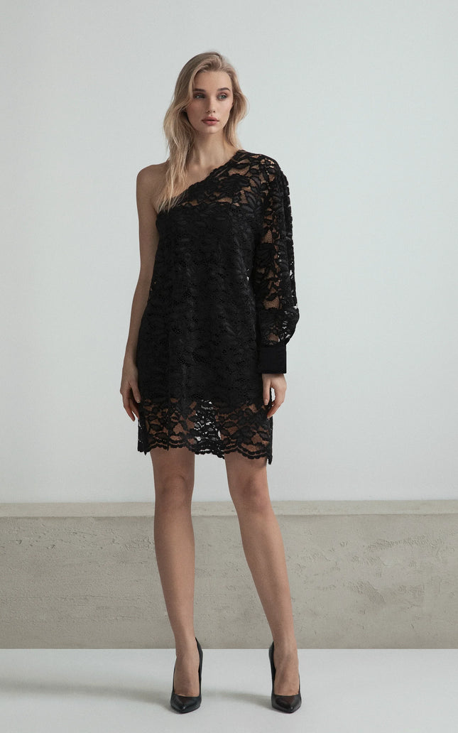 Woman wearing a black lace one-shoulder dress with long sleeve and scalloped hem