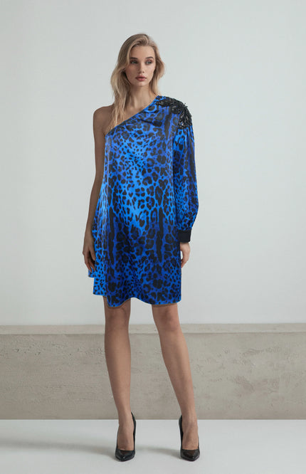 Woman wearing blue leopard print one-shoulder dress with long sleeve, fashion photo