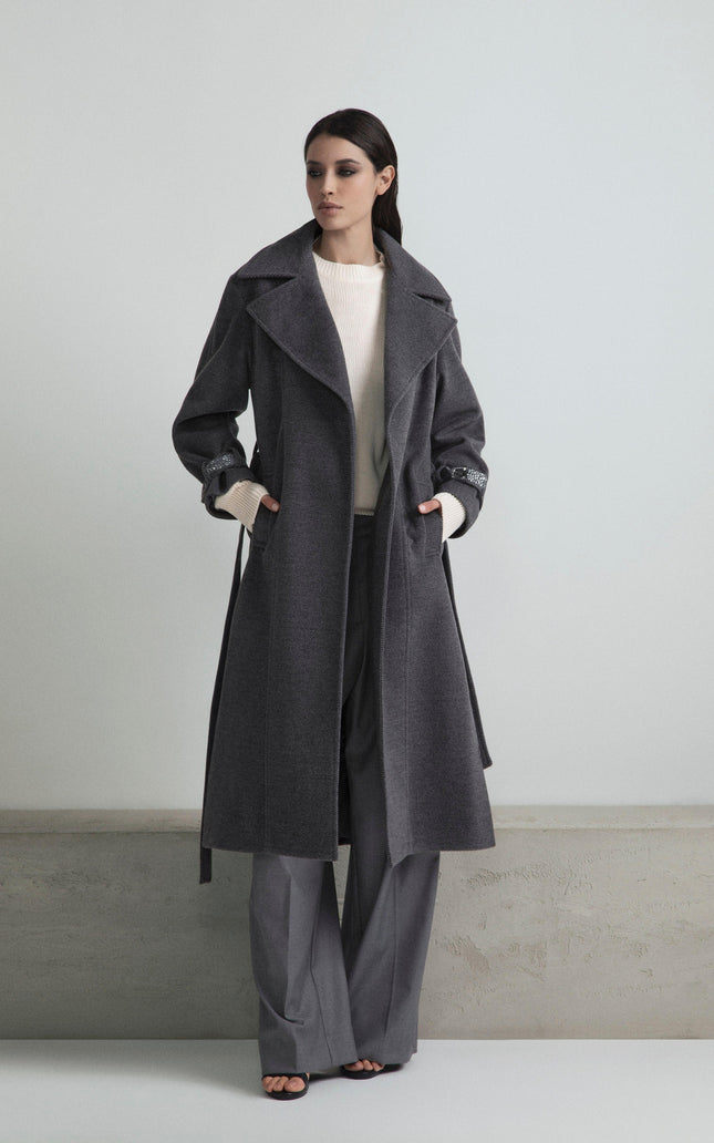 Woman in stylish gray coat and wide-leg pants, modern minimalist outfit
