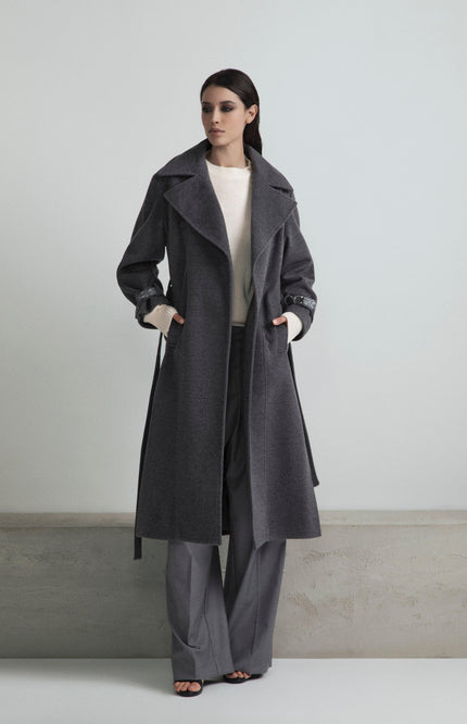 Woman in stylish gray coat and wide-leg pants, modern minimalist outfit