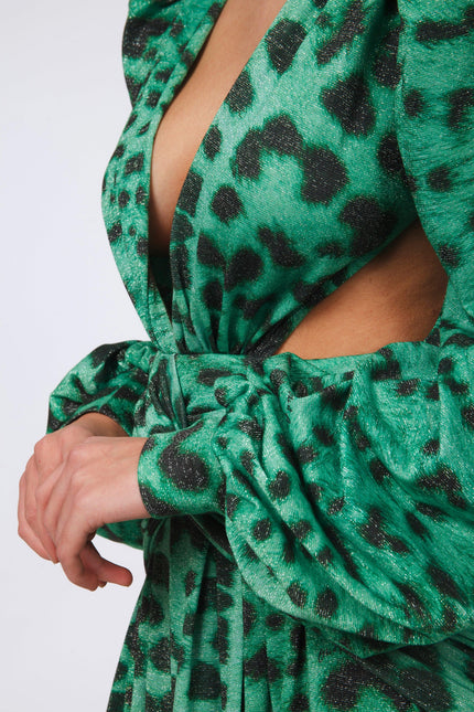 Close-up of a green animal print dress with deep V neckline and puff sleeves