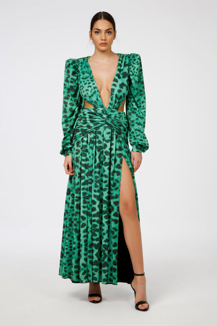 Woman wearing green animal print maxi dress with deep V-neck, puff sleeves, and high slit