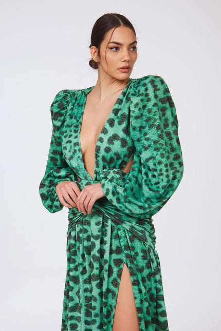 Woman wearing bold green leopard print dress with puff sleeves, deep V-neck, and thigh-high slit